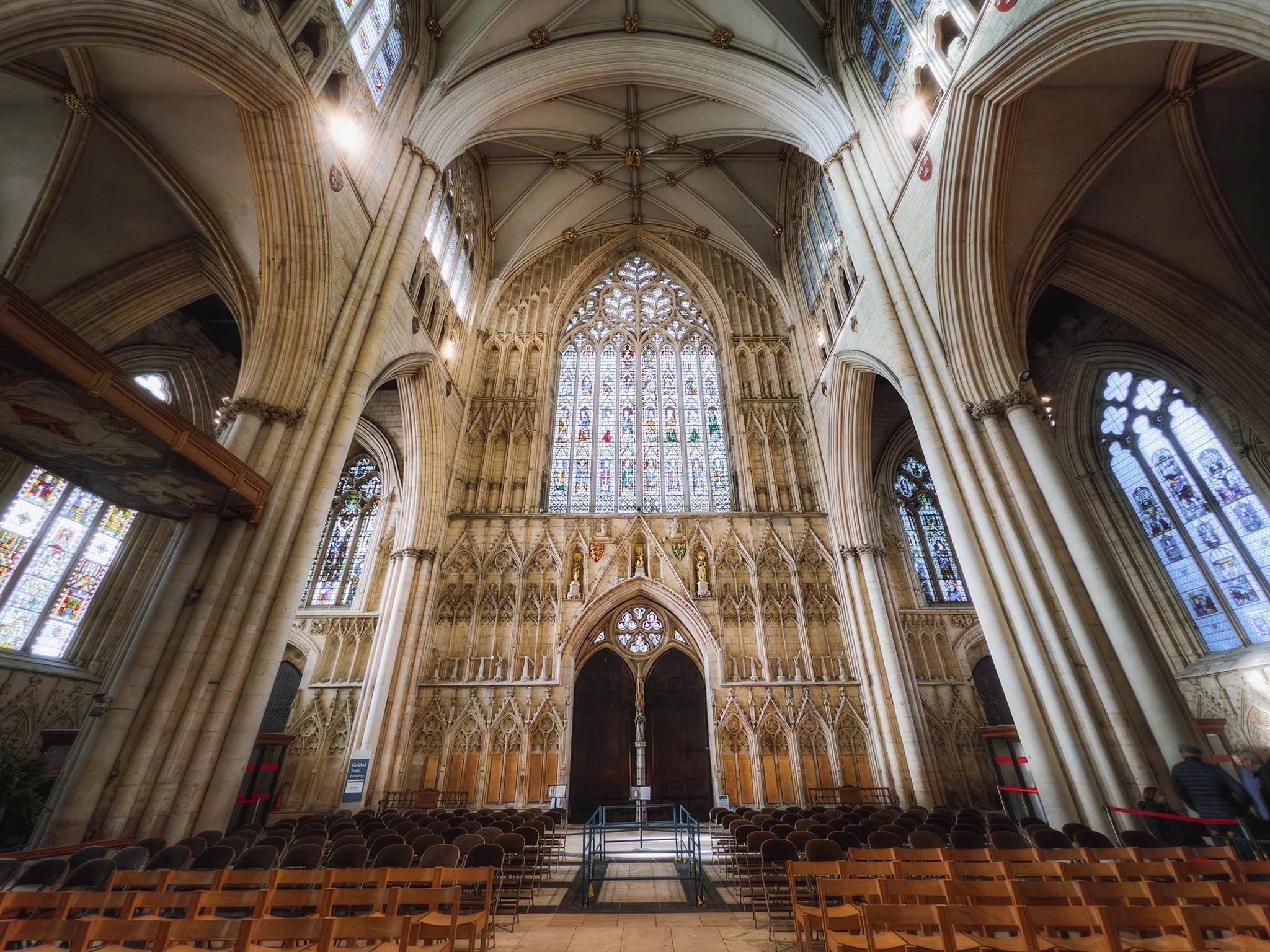 Looking towards the West Window in the Minster’s main nave. The Great West Window, or ‘Heart of Yorkshire’—the church’s second-largest of 128 windows—was built by master mason Ivo de Raghton in 1338–39 as part of the west front.