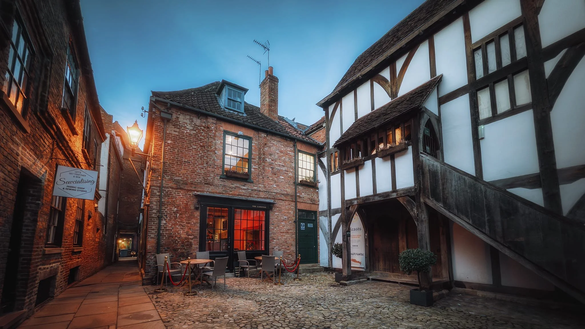 Hidden away down a narrow alley called Coffee Yard between Grape Lane and Stonegate, the timber-framed building is Barley Hall. Built around 1360 by monks of Nostell Priory and extended in the 15th century, the hall fell into decline over the centuries, becoming subdivided and dilapidated by the 20th century. The York Archaeological Trust purchased it in 1987, restored it extensively, and reopened it as Barley Hall museum.